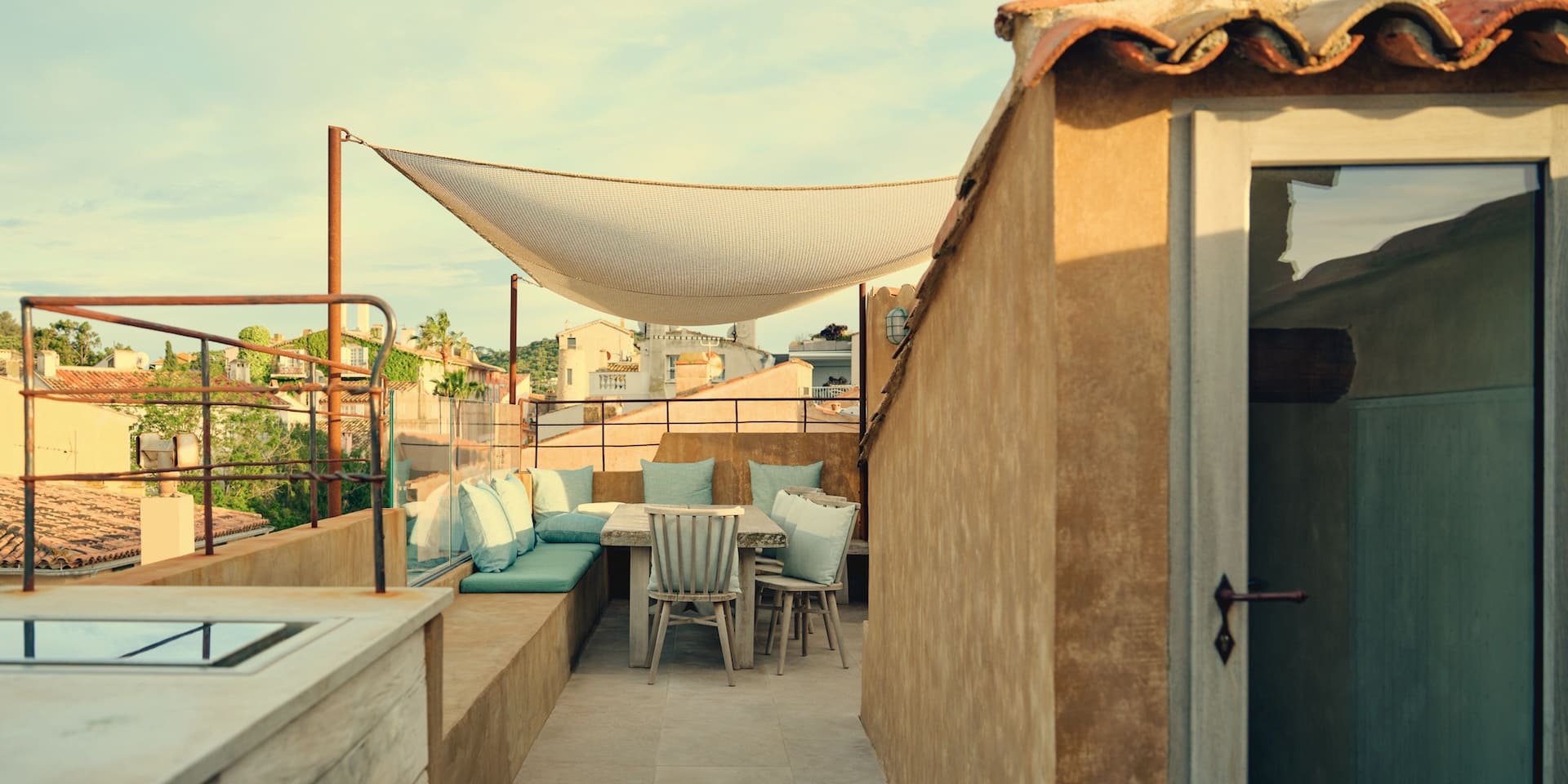 Spacious living room of the Picasso apartment opening onto the terrace with a sea view.